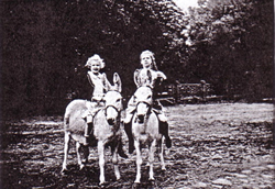 Kids on donkeys, before 1945